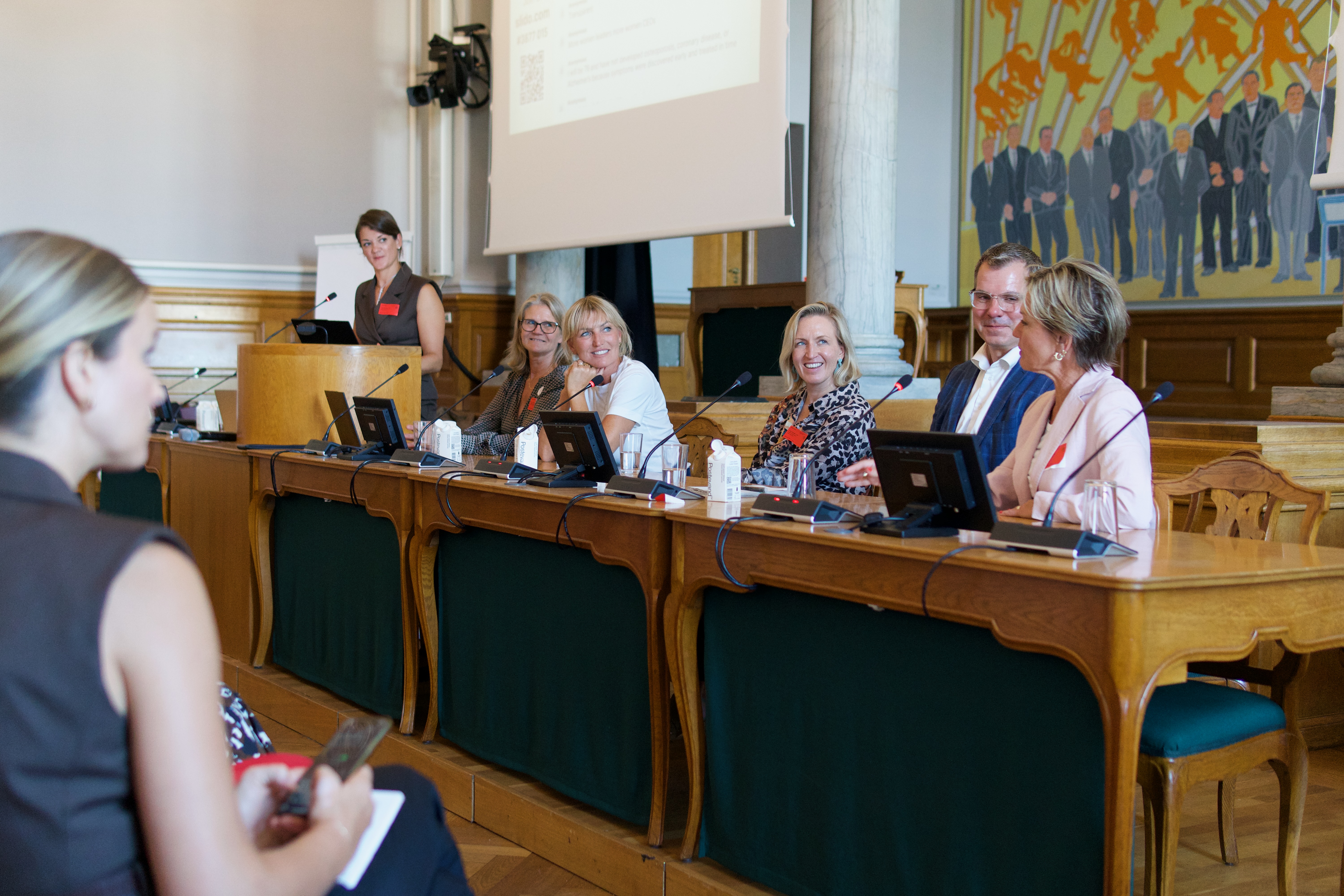 Panel of contributors at the parliament desk