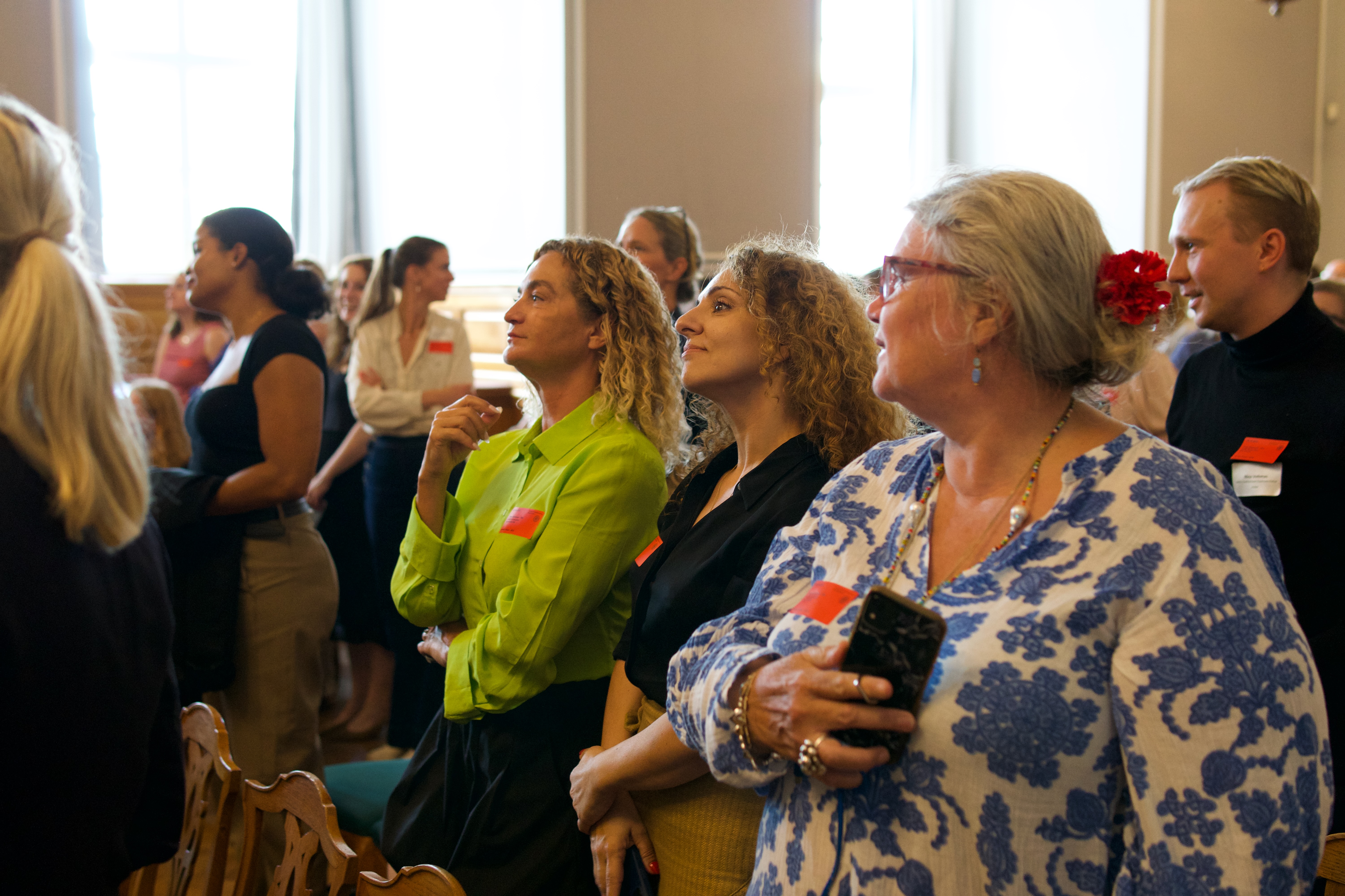 Contributors standing and engaging during the session